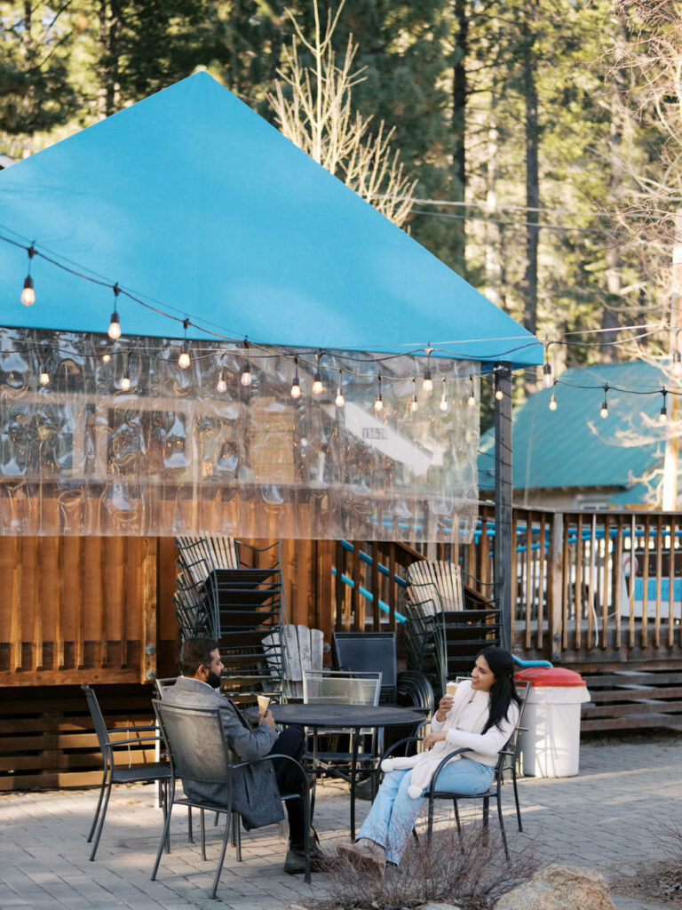 Couple enjoying ice cream in late winter al lake tahoe
