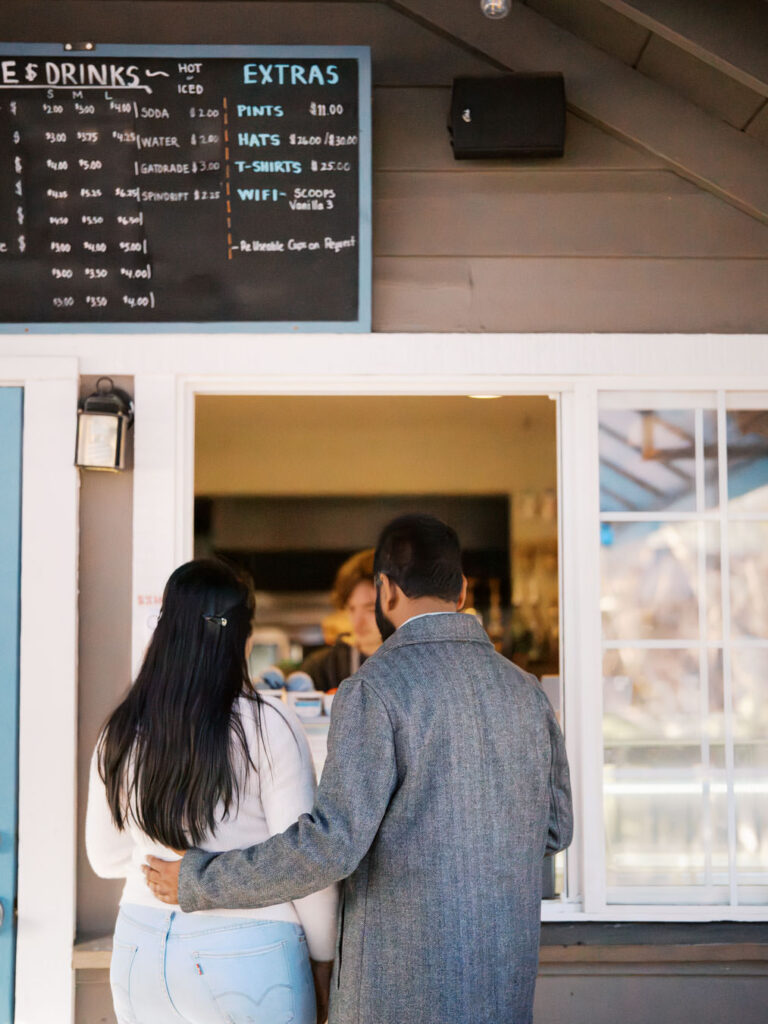 Couple ordering ice cream in winter at lake tahoe