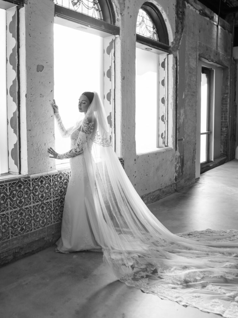 Black and white bridal portrait with cathedral veil and lace gown, Ybor City Tampa wedding photographer