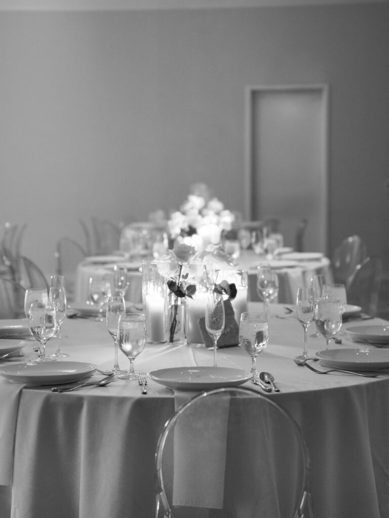 Elegant black and white wedding reception tablescape with candles and glassware, Ybor City wedding
