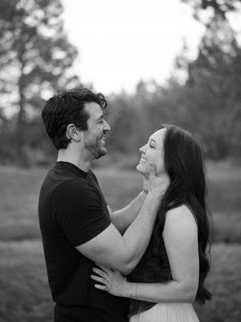 Couple laughing into each others face captured by a Reno photographer in a couples session