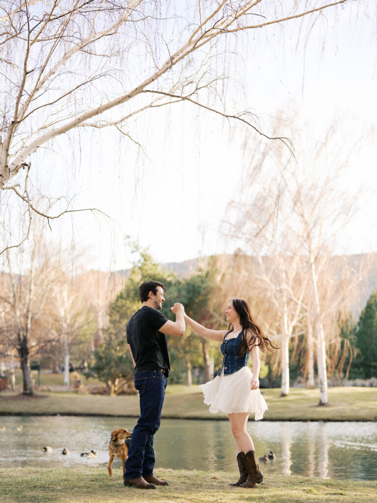 Couple spinning with dress movement captured by a Reno photographer in a couples session