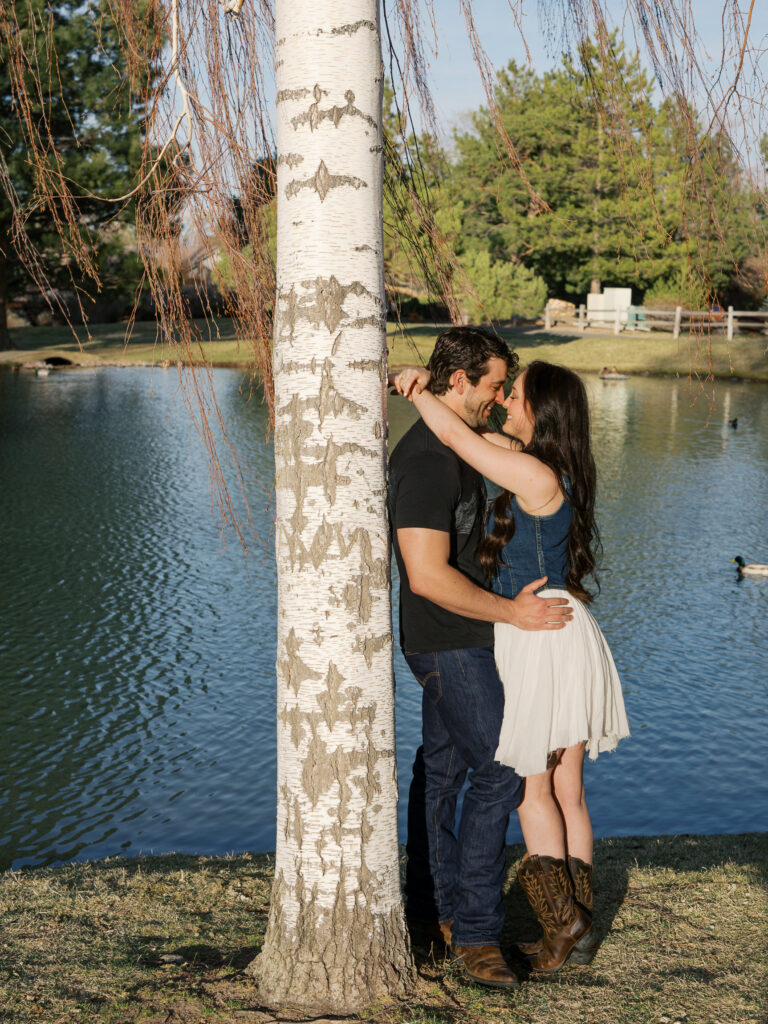 Couple leaning againts a tree captured by a Reno photographer in a couples session
